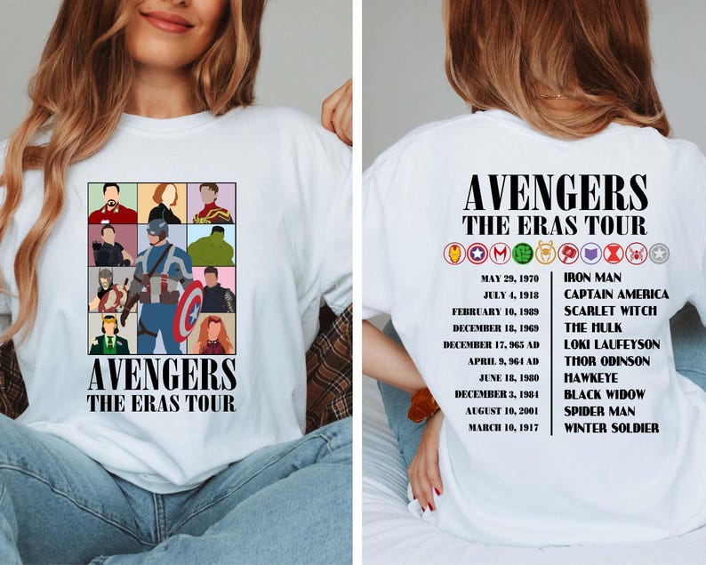 May include: White t-shirt with a graphic of the Avengers characters and the text "Avengers The Eras Tour". The back of the shirt has a list of the Avengers characters and their first appearances.