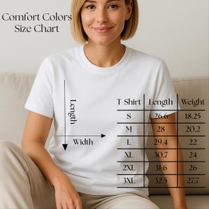 May include: A woman in a white t-shirt, with a size chart for Comfort Colors shirts. The chart displays length and weight measurements in inches and ounces for sizes S to 3XL. The text "Comfort Colors Size Chart" is at the top.