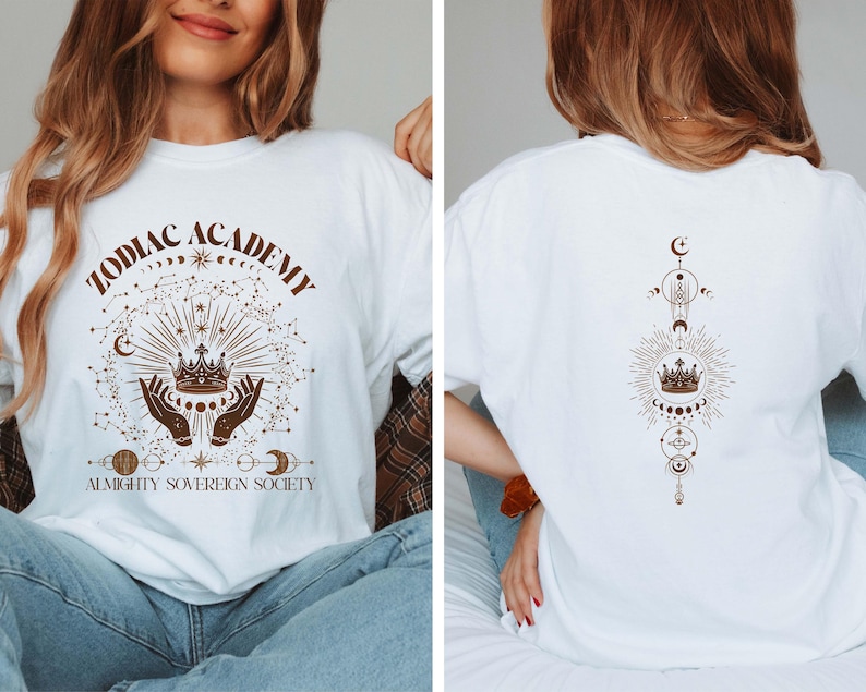 May include: White t-shirt with a brown graphic design featuring a crown, stars, and the text "Zodiac Academy Almighty Sovereign Society". The back of the shirt has a similar design with a crown, stars, and moons.