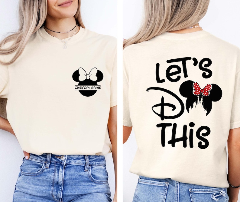 May include: Cream-colored t-shirt featuring a black Minnie Mouse design with a bow and the text "CUSTOM NAME" on the front. The back of the shirt displays the words "Let's Do This" with a Minnie Mouse silhouette.