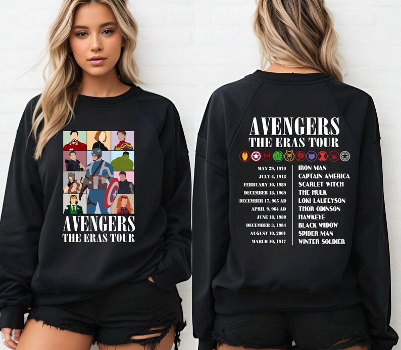 May include: Black sweatshirt with a graphic of the Avengers characters and the text "Avengers The Eras Tour". The back of the sweatshirt has a list of the Avengers characters with their first appearance dates.