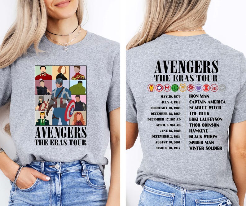 May include: Gray t-shirt with a graphic of the Avengers characters and the text "Avengers The Eras Tour". The back of the shirt has a list of the Avengers characters and their corresponding dates.