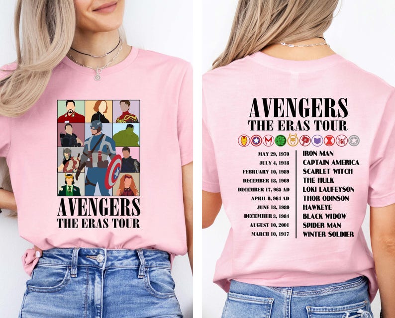 May include: Pink t-shirt with a graphic of the Avengers characters and the text "Avengers The Eras Tour". The back of the shirt lists the Avengers characters with their corresponding dates.