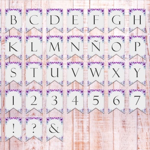 May include: A set of 36 white paper pennant flags with purple floral designs. The flags feature the alphabet, numbers 0-9, and punctuation marks such as an exclamation point, question mark, and ampersand.