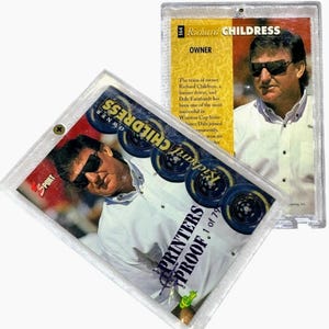 May include: Two Richard Childress trading cards in protective cases. One card features a photo of Richard Childress wearing sunglasses, with the text "OWNER" and "PRINTERS PROOF 1 of 79". The other card has a photo of Richard Childress and text.