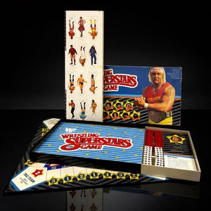 May include: Vintage WWF Wrestling Superstars Game. The game box features Hulk Hogan. The game includes a game board, cards, and wrestler cutouts. The box is blue and red with white stars.