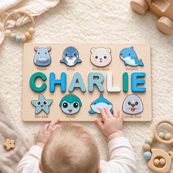 A custom wooden name puzzle with animals is a genuinely charming, tactile first gift that doubles as nursery decor — real craft, real purpose.