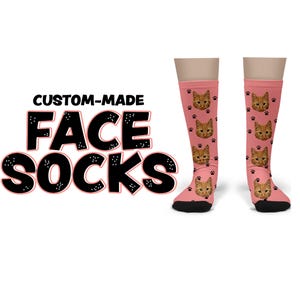 May include: Custom-made face socks with a pink background and a cat face pattern. The text "CUSTOM-MADE FACE SOCKS" is printed in black.