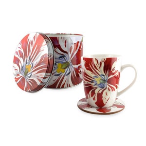 Puede incluir: Una taza de cerámica blanca con un diseño de tulipán rojo y blanco. La taza viene con un posavasos a juego y una lata con tapa que tiene el mismo diseño de tulipán.