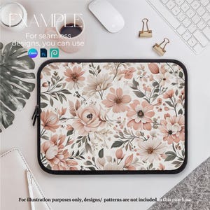 May include: A laptop sleeve with a floral pattern featuring pink and white flowers on a white background. The sleeve has a zipper closure and a black border.