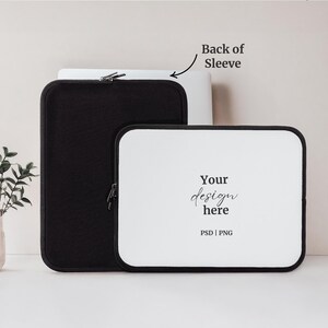 May include: White laptop sleeve with a black zipper and the text "Your design here PSD | PNG" on the front. The back of the sleeve is black.
