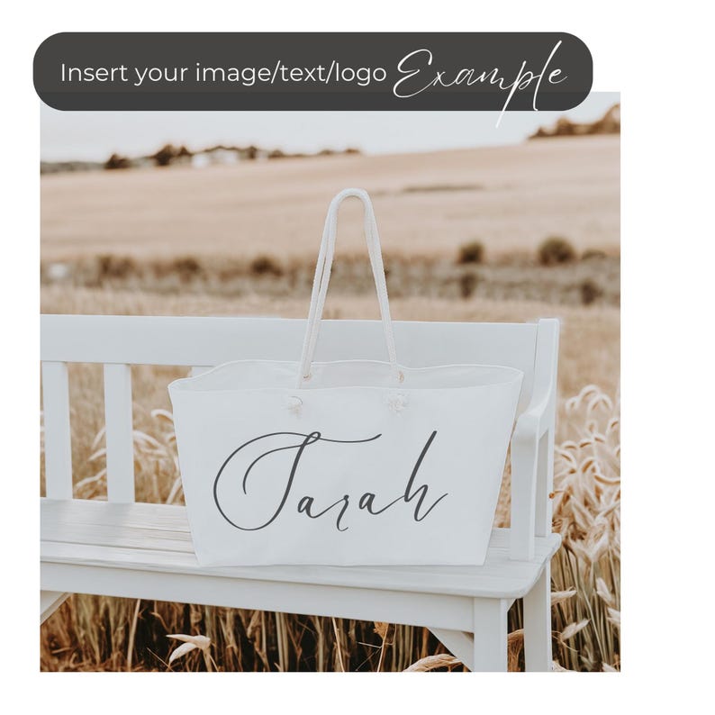 May include: White tote bag with the name "Sarah" written in cursive on the front. The bag is sitting on a white bench in a field.