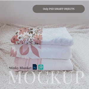 May include: A stack of three white minky blankets with pink floral patterns. The top blanket has a floral pattern, the middle blanket has a leaf pattern, and the bottom blanket has a striped pattern. The blankets are on a white fluffy surface. The text "Minky Blanket" is visible on the bottom blanket.