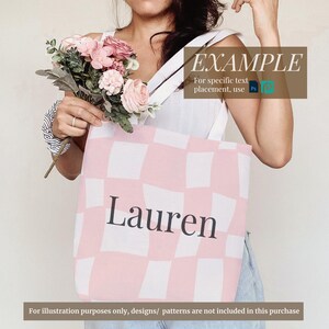 May include: A pink and white checkered tote bag with the name "Lauren" printed in black. The bag is being held by a person.