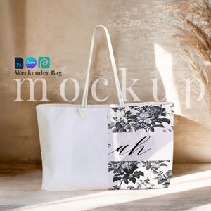 May include: White canvas tote bag with rope handles. The bag features a floral print in black and white on one side, with the name "Sarah" in elegant script. The words "Weekender Bag" and "mockup" are also visible.