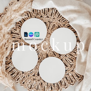 May include: Four round white coasters on a woven straw placemat with a beige cloth napkin. The coasters are blank and ready for customization. The text "Round Coaster" is visible on one of the coasters.