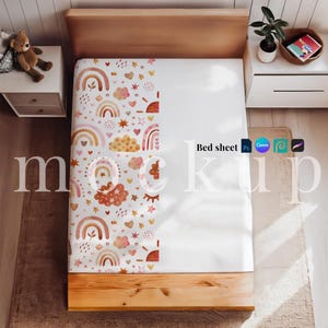 May include: A white bed sheet with a colorful pattern of rainbows, clouds, hearts, and stars. The sheet is on a wooden bed frame. The words "Bed sheet" are visible on the sheet. The image also includes a teddy bear and a small plant.