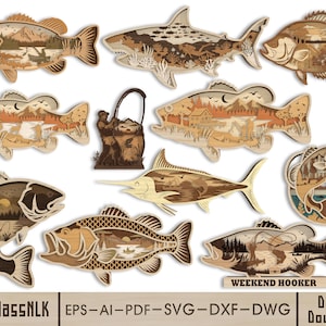 Puede incluir: Una colección de arte mural de madera en capas con forma de pez que presenta intrincadas escenas al aire libre de montañas, bosques y actividades de pesca. El conjunto incluye varias especies de peces y el texto WEEKEND HOOKER.