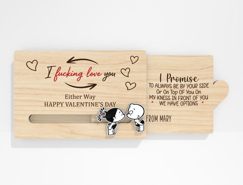 May include: A wooden Valentine's Day card with the text "I fucking love you" and "Happy Valentine's Day." The card features a sliding mechanism and a cartoon couple kissing. The second part of the card reads "I Promise..." and "From Mary."