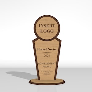 May include: A wooden award plaque with a circular top section featuring the text INSERT LOGO and a tapered base section. The base displays the name Edward Norton, the year 2026, the text ACHIEVEMENT AWARD, and In recognition of your outstanding contribution.