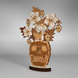 May include: A wooden skull sculpture with a bouquet of white flowers with skull faces on the petals. The flowers are arranged in a vase shaped like a skull.