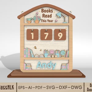 May include: Wooden bookshelf-shaped counter with the text "Books Read This Year" and the number "179". The name "Andy" is displayed below the counter. The design includes illustrations of books, plants, and a desk lamp.