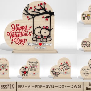 May include: Wooden Valentine's Day decorations in heart shapes. One features a couple on a swing with "Happy Valentine's Day" and names. Other designs include phrases like "Forever Yours" and "I love you more".