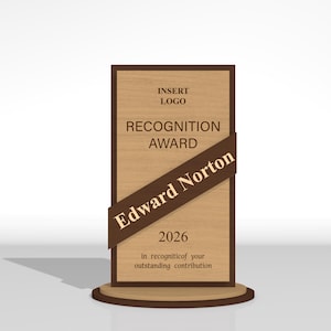 May include: A rectangular wooden recognition award plaque with a dark brown border and a circular base. The text reads: INSERT LOGO, RECOGNITION AWARD, Edward Norton, 2026, and in recognition of your outstanding contribution on a diagonal brown banner.