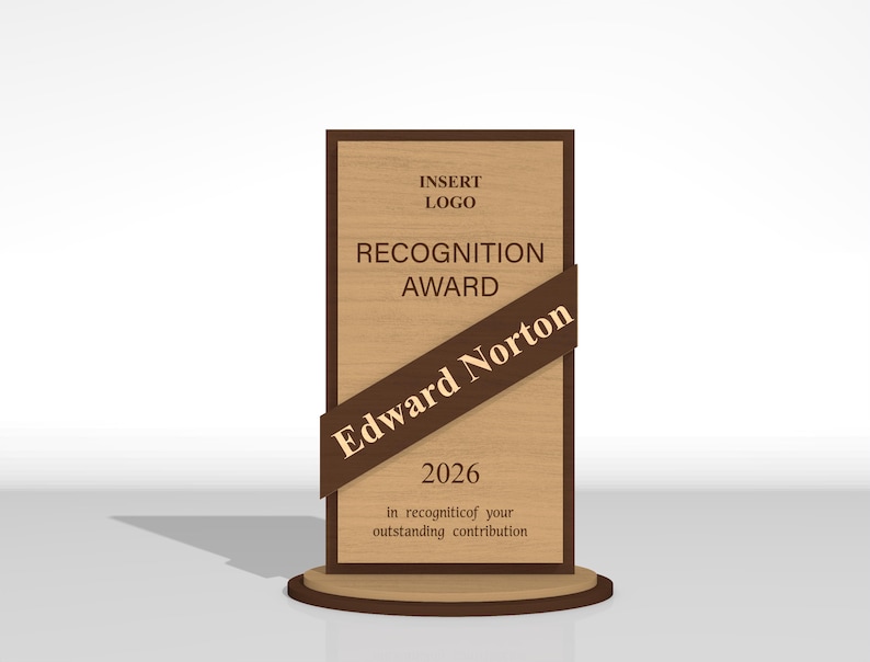 May include: A rectangular wooden recognition award plaque with a dark brown border and a circular base. The text reads: INSERT LOGO, RECOGNITION AWARD, Edward Norton, 2026, and in recognition of your outstanding contribution on a diagonal brown banner.