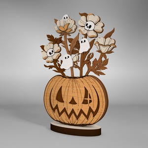 May include: A wooden pumpkin with a carved jack-o'-lantern face, decorated with a bouquet of white flowers and ghosts.