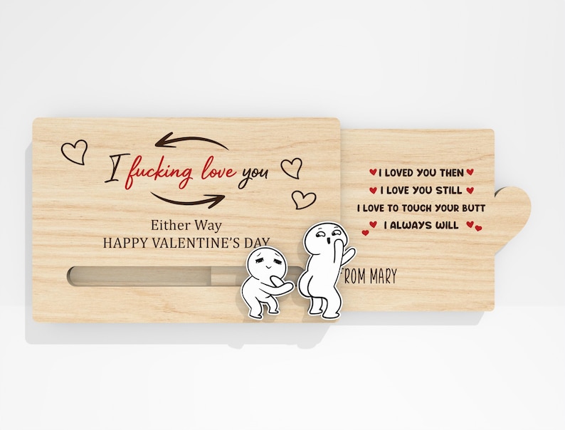 May include: A wooden Valentine's Day card with the text "I fucking love you" and "Either Way HAPPY VALENTINE'S DAY". The card features cartoon figures and the message "I loved you then, I love you still, I love to touch your butt, I always will".