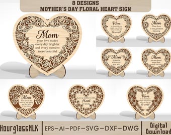 May include: Wooden heart-shaped signs with floral designs and the word "Mom" in various styles. Each sign has a unique message, such as "Your love makes every day brighter." The signs are displayed on wooden stands, perfect for Mother's Day.