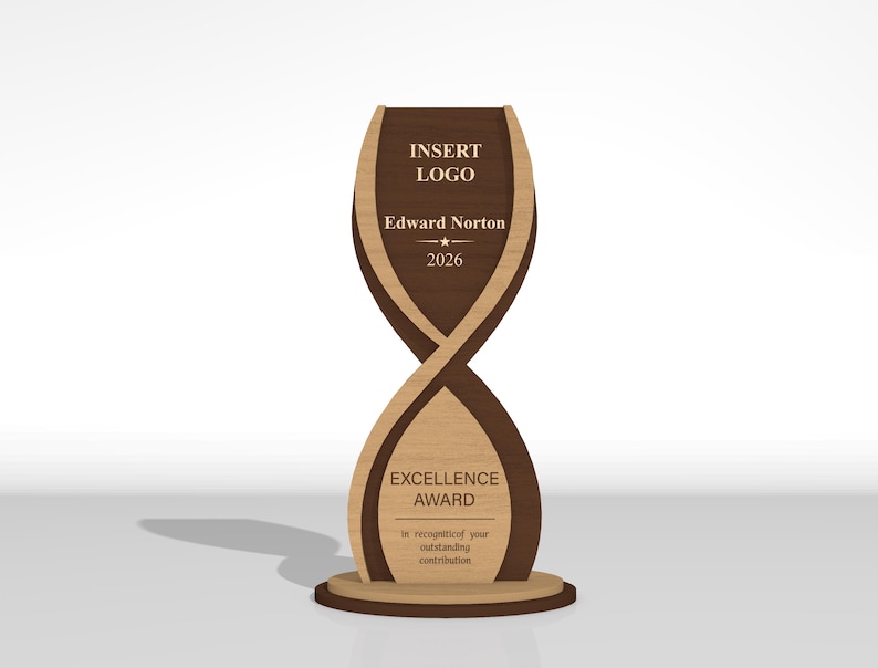 May include: A vertical wooden award trophy with a twisted hourglass shape, featuring dark and light wood tones. The top section displays the text INSERT LOGO, Edward Norton, and 2026. The bottom section features the text EXCELLENCE AWARD.