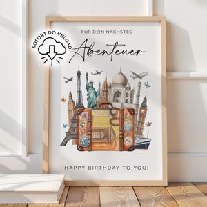 May include: Framed travel-themed print. The artwork depicts a vintage suitcase with landmarks such as the Eiffel Tower, Statue of Liberty, and Taj Mahal. Text includes "Für dein nächstes Abenteuer" and "Happy Birthday to You!"