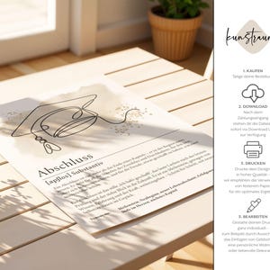 May include: A print featuring a minimalist line drawing of a graduation cap. The artwork is on a cream-colored paper and includes German text, including the word "Abschluss" (graduation). The print is displayed on a light-colored wooden surface.