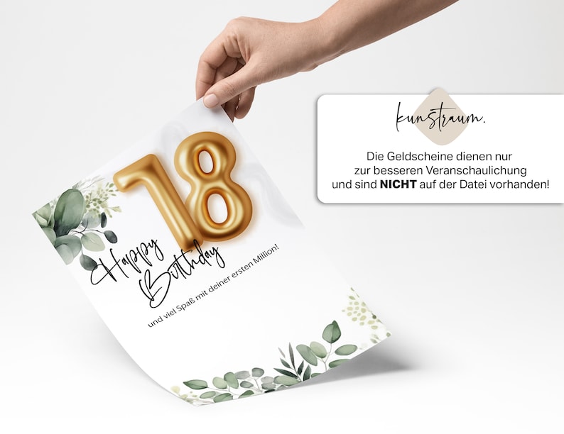 May include: A white card with a gold foil 18 on it. The card has a green leafy design and the text "Happy Birthday" and "und viel Spa&szlig; mit deiner ersten Million!"  The card is being held by a hand. The text "kunstraum. Die Geldscheine dienen nur zur besseren Veranschaulichung und sind NICHT auf der Datei vorhanden!" is on a separate white card.