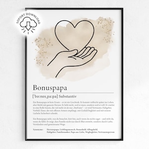 May include: Black framed art print featuring a line drawing of a heart held in an open hand. The word "Bonuspapa" is printed below the image, along with a definition in German. The background has a beige watercolor wash.