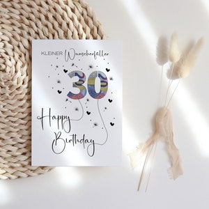 Peut inclure: Une carte blanche avec le texte "KLEINER Wunschertaller" et "Happy Birthday" avec le chiffre 30 fait d'argent au centre. Le chiffre 30 est entour&eacute; de petits c&oelig;urs noirs et de graines de pissenlit.