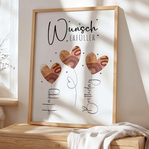 May include: A framed print with a light wood frame. The artwork features three heart-shaped balloons made of Euro banknotes, each with a "10" printed on them. The words "Happy Birthday" and "Wunsch Erf&uuml;ller" are written in black script.
