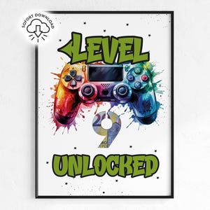 May include: A framed print featuring a colorful watercolor-style image of a video game controller. The words "LEVEL 9 UNLOCKED" are displayed in green, with the number 9 in the center. The controller is painted with vibrant hues.
