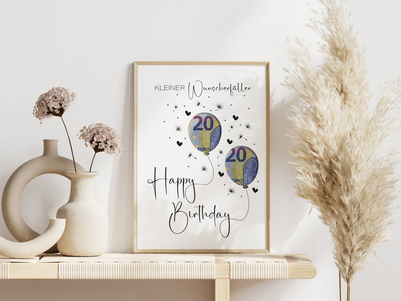 K&ouml;nnte beinhalten: Eine wei&szlig;e Karte mit schwarzem Text, der "KLEINER Wunscherraller. Happy Birthday." lautet. Zwei Zwanzigeuro-Scheine befinden sich in zwei auf die Karte gezeichneten Ballons.