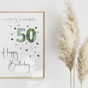 May include: A white framed print with the text "KLEINER Wunscherraller" and "Happy Birthday" with a 50 euro bill shaped like a balloon with dandelion seeds and hearts around it.