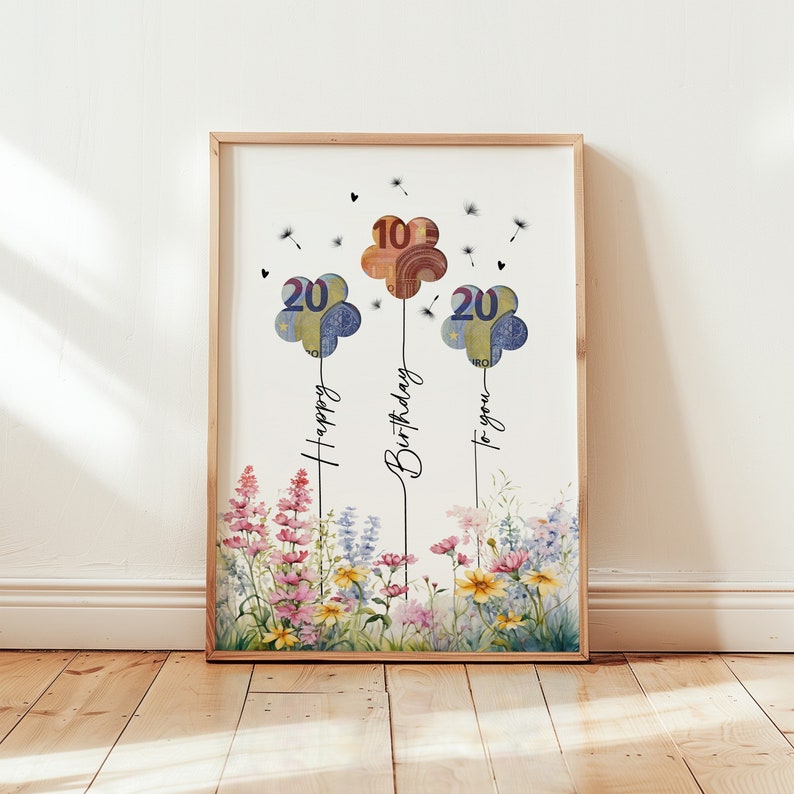 Blumiges Geldgeschenk zum Geburtstag als digitaler Sofort-Download. Drei Ballons  in Blumenform mit Euro-Scheinen hinterlegt steigen über einem bunten Wildblumenfeld in die Luft, begleitet von Pusteblumen und der Aufschrift „Happy Birthday to you“. Ein liebevolles, fröhliches Geburtstagsbild zum Ausdrucken – ideal als DIY-Geschenk in Form eines Bildes oder einer selbstgebastelten Karte für Blumenliebhaber.