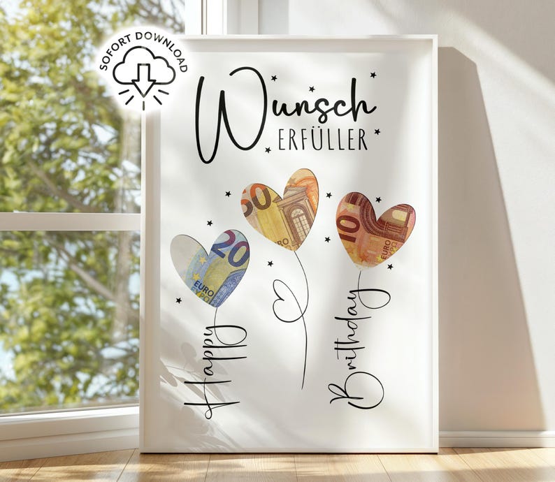 May include: White framed art print featuring three heart-shaped flowers made of Euro banknotes. The words "Happy Birthday" and "Wunsch Erf&uuml;ller" are written in cursive. A download icon is in the upper left corner.