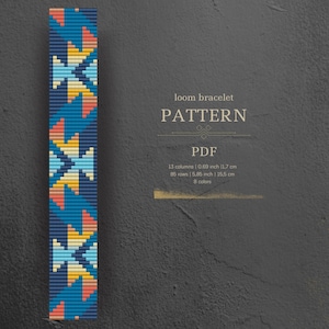 May include: A loom bracelet pattern with a geometric design in shades of blue, yellow, orange, and pink. The pattern is 13 columns wide and 85 rows long, and it uses 8 colors. The pattern is for a loom bracelet that is 0.69 inches wide and 5.85 inches long.