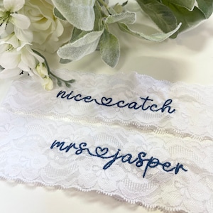 Personalized / Monogrammed Embroidered WHITE  Lace Wedding and Toss Garters.  New Heart Script font/ Something Blue! Nice Catch Garter