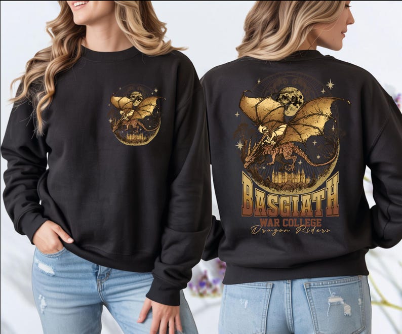 a woman wearing a black sweatshirt with a graphic design on the back. The design includes a golden dragon and stars, along with the text "BASGIATH WAR COLLEGE Dragon Riders".