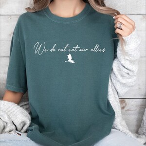 a woman wearing a t - shirt that says we do not allow others