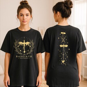 A woman wearing a black t-shirt with a gold design on the front and back.