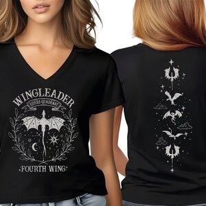 A woman wearing a black t-shirt with a graphic design featuring a bat and the text "WINGLEADER" and "FOURTH WING!" printed on it.